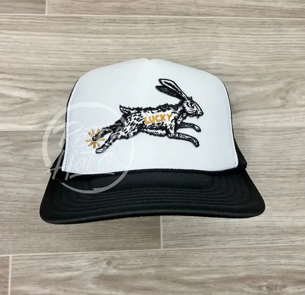 Lucky Rabbit on Black/White Meshback Trucker Hat